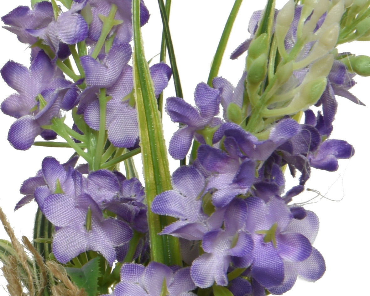 Flores artificiales de poliéster surtidas con cinta.