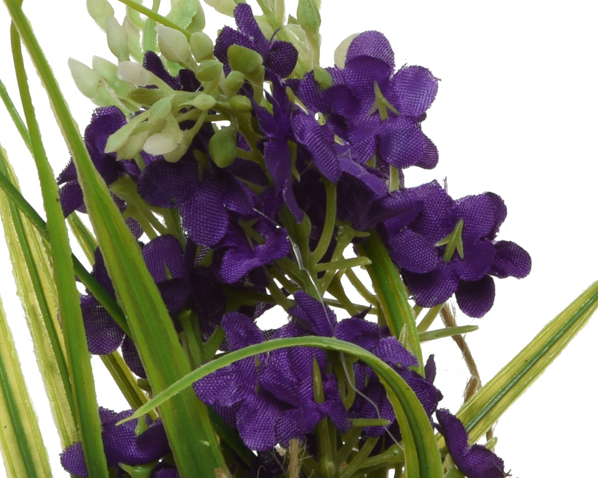 Flores artificiales de poliéster surtidas con cinta.